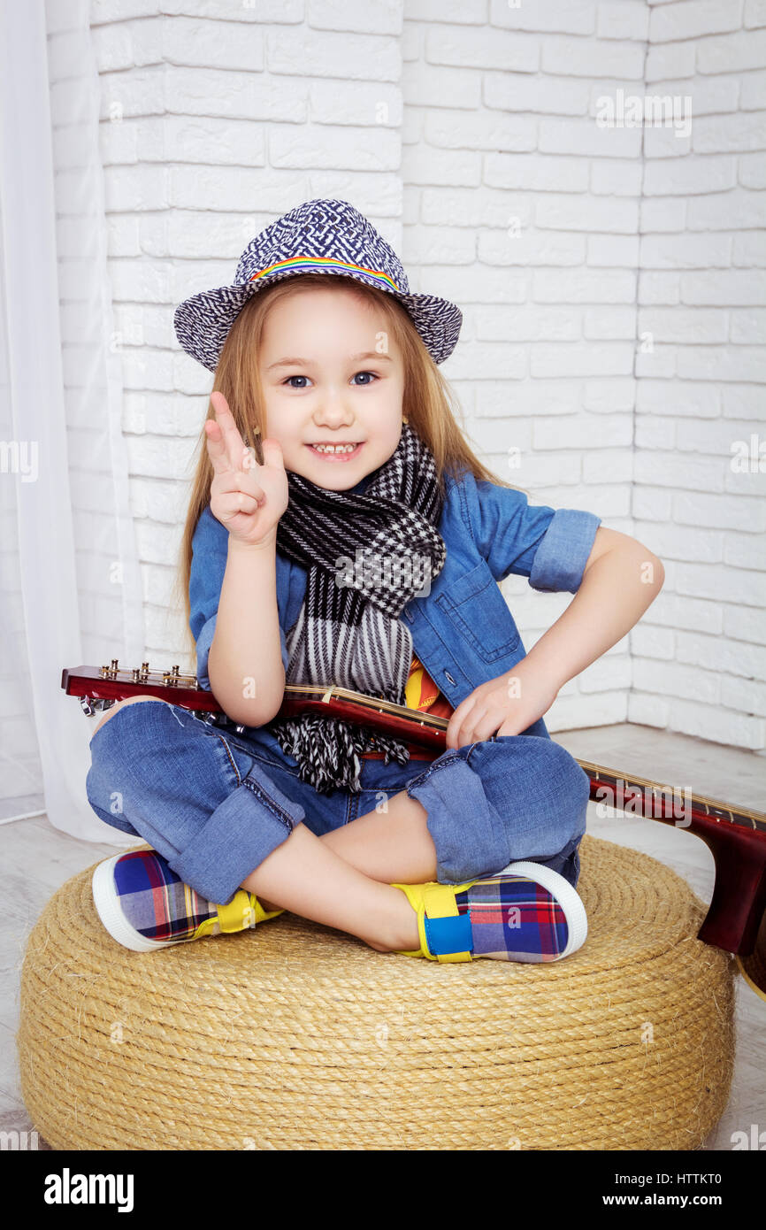 little girl sitting in the lotus position Stock Photo