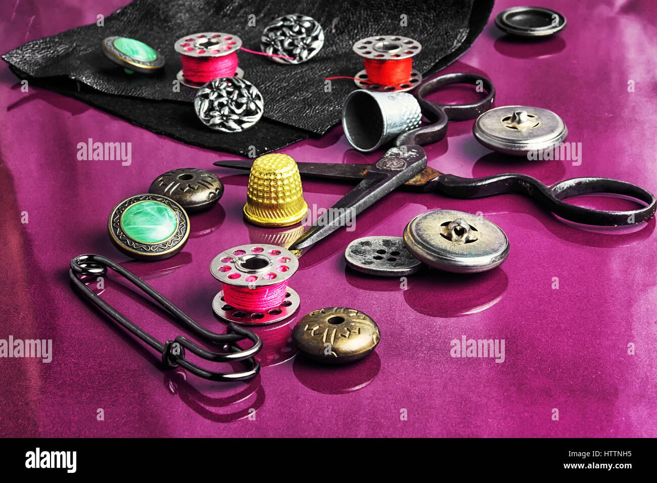 Set of beautiful buttons,sewing needle and bobbin Stock Photo - Alamy