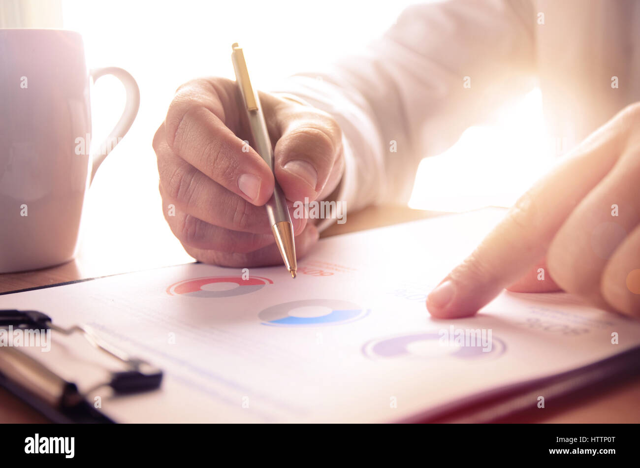 Businessman study financial report. Concept for business, finance, market research, analytics and statistics, marketing. Stock Photo