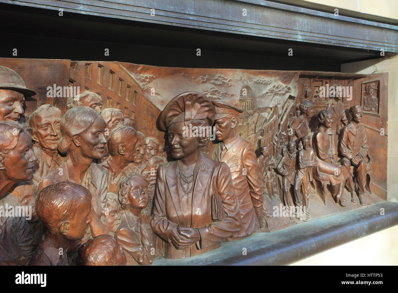 Bronze relief of Queen Elizabeth the Queen Mother and King George V1 talking to people during the blitz Stock Photo