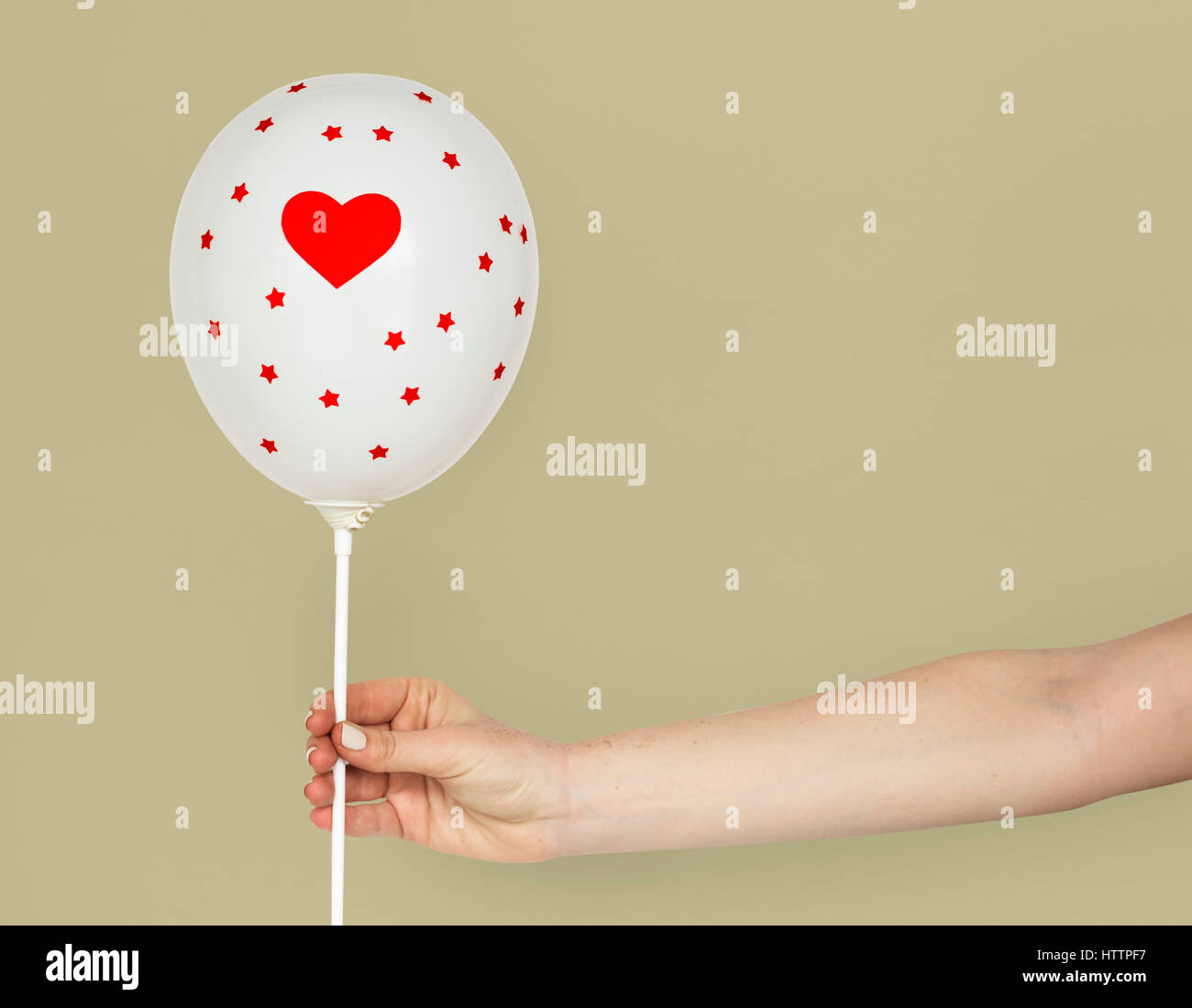 Hands holding balloon hi-res stock photography and images - Alamy