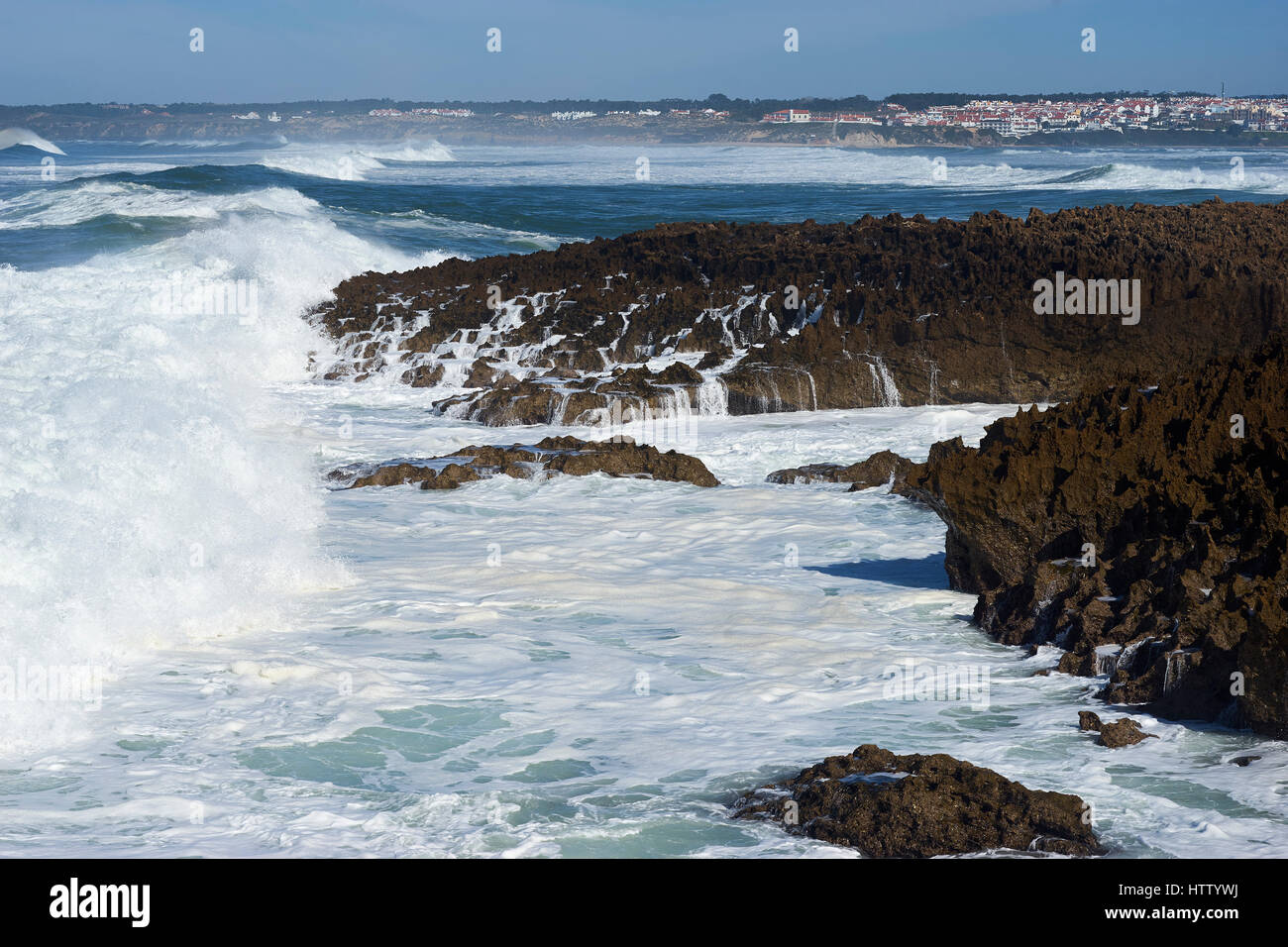 Rugged coastline, waves breaking on rocks, near Vila Nova de Milfontes, Alentejo, Portugal Stock Photo