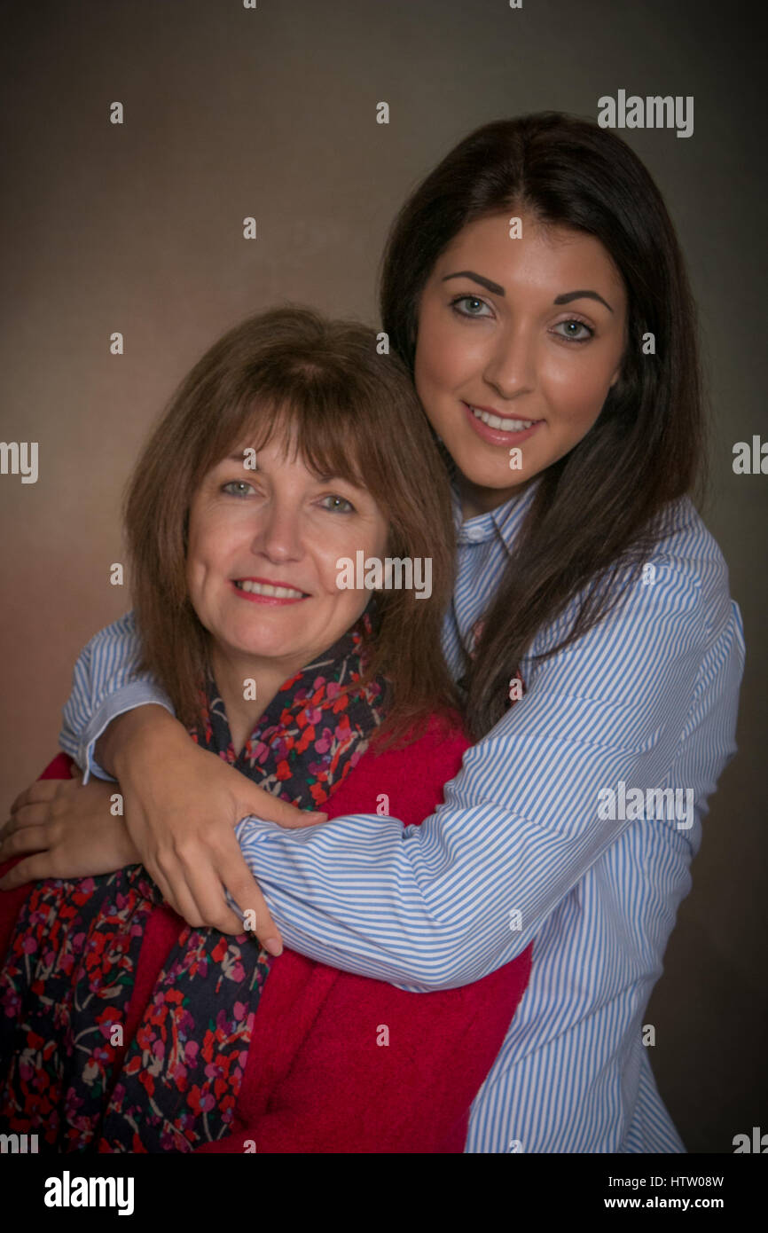 Mother and daughter in a close embrace Stock Photo