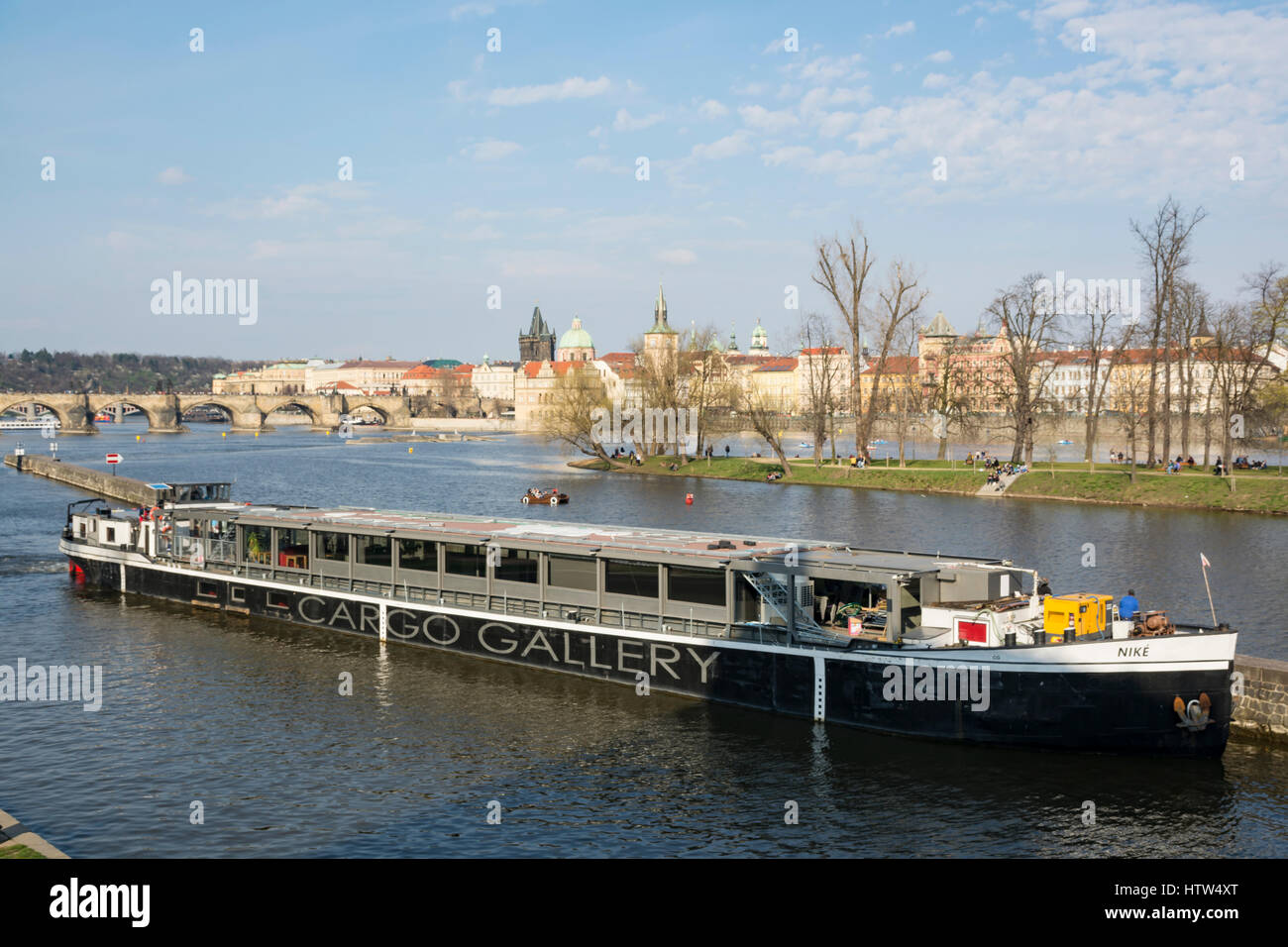 Cruise boat on the Vltava river looking towards the Charles Bridge in Prague, Czech Republic Stock Photo
