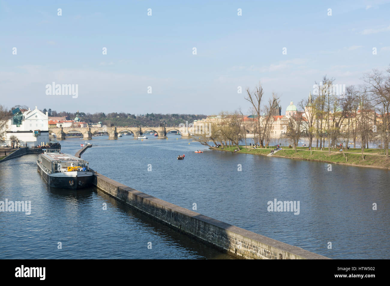 Cruise boat on the Vltava river looking towards the Charles Bridge in Prague, Czech Republic Stock Photo