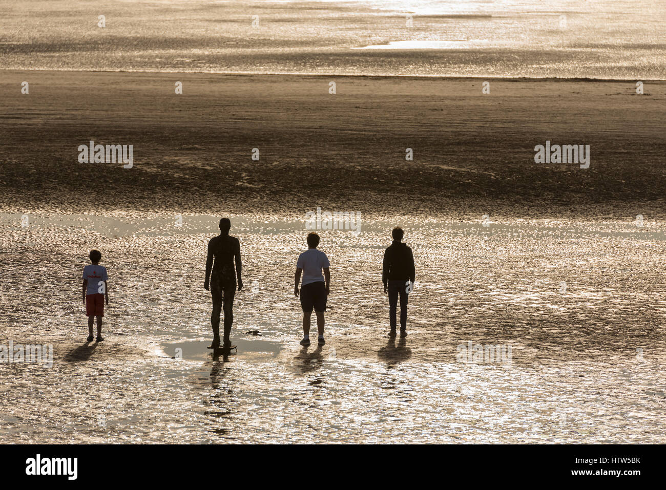 Another Place Antony Gormley Crosby beach statues sunset Stock Photo