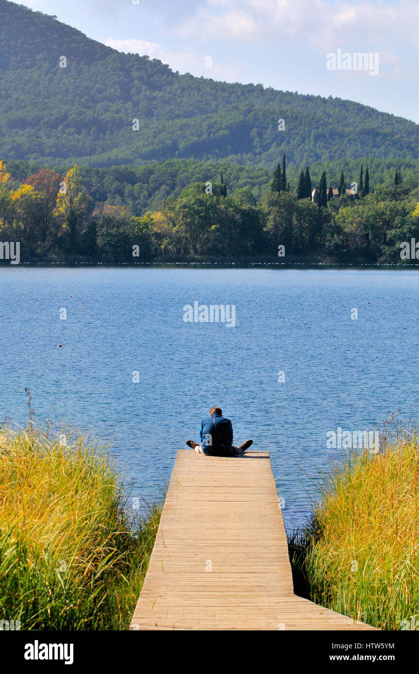 Man resting. Estany de Banyoles lake, Banyoles, Pla de l´Estany, Girona province, Catalonia, Spain Stock Photo