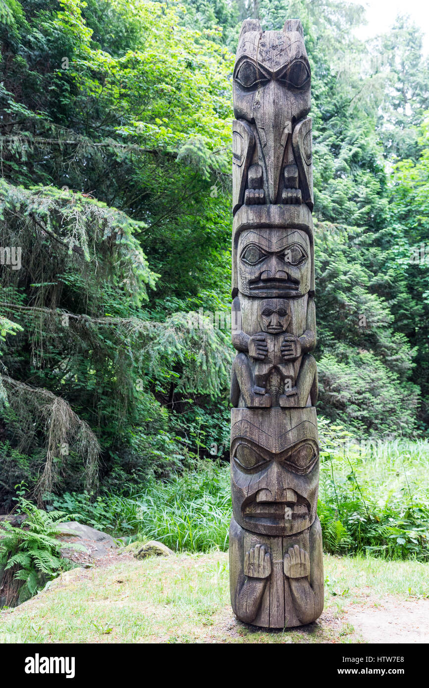 An old Inuit totem pole in the Alaskan forest Stock Photo
