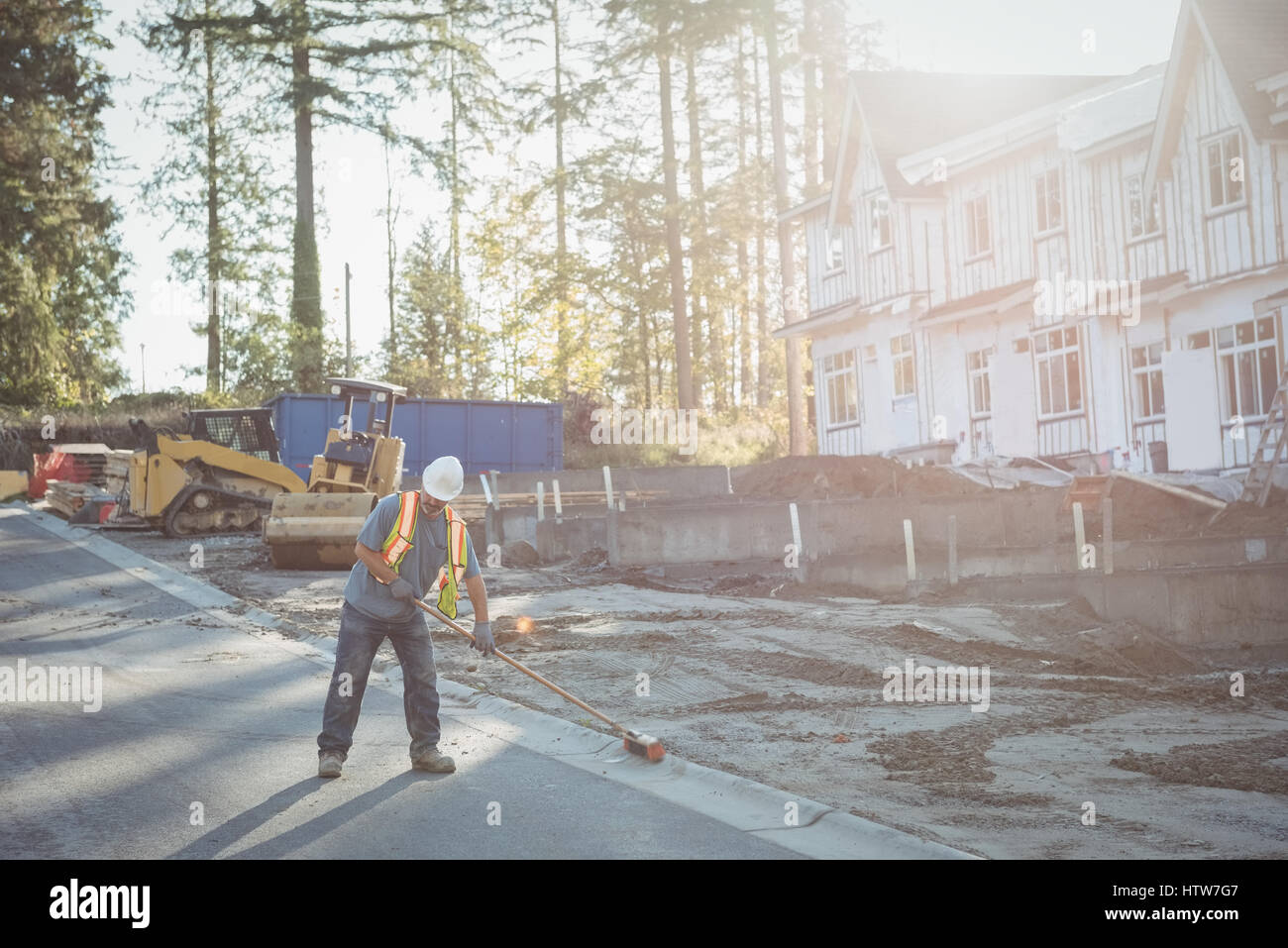 Construction worker working at construction site Stock Photo - Alamy