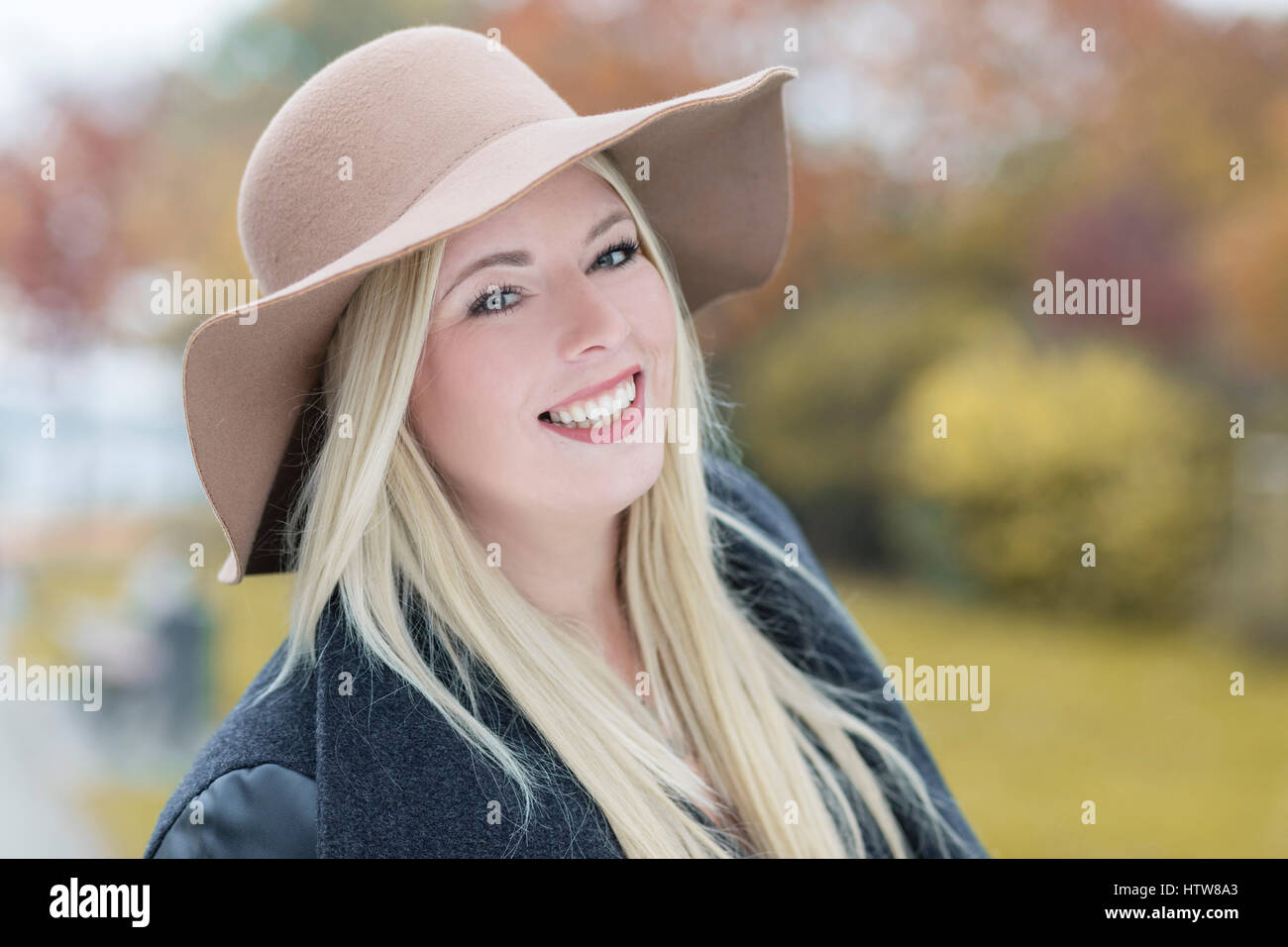 Portrait of a young woman with hat Stock Photo - Alamy