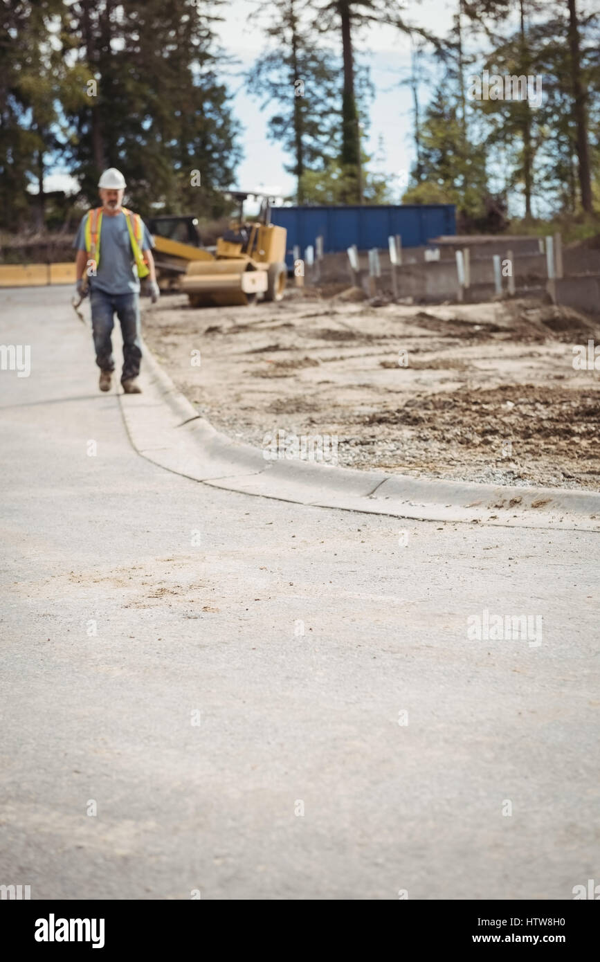 Construction worker at construction site Stock Photo - Alamy