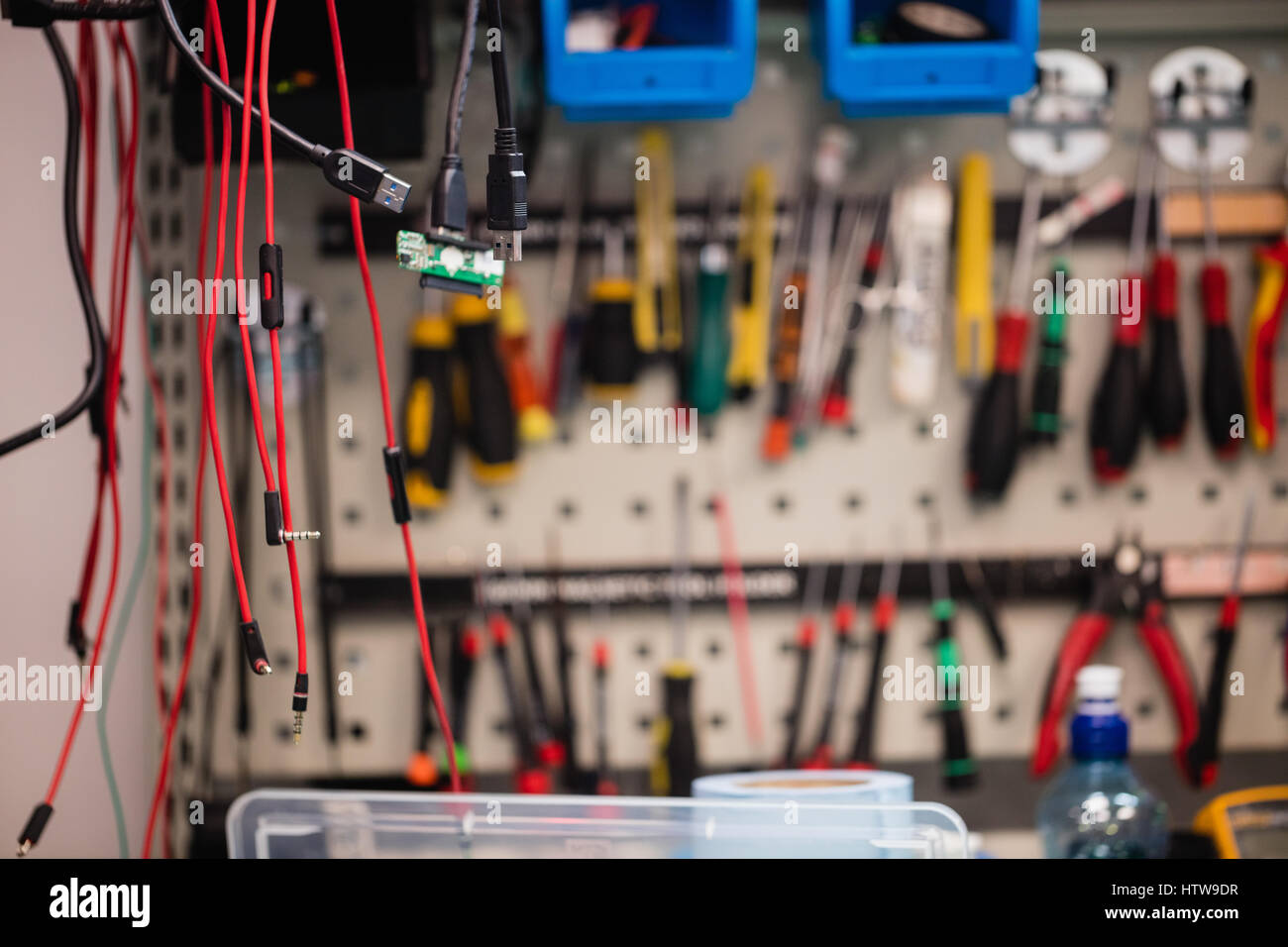 Data cables hanging in repair shop Stock Photo