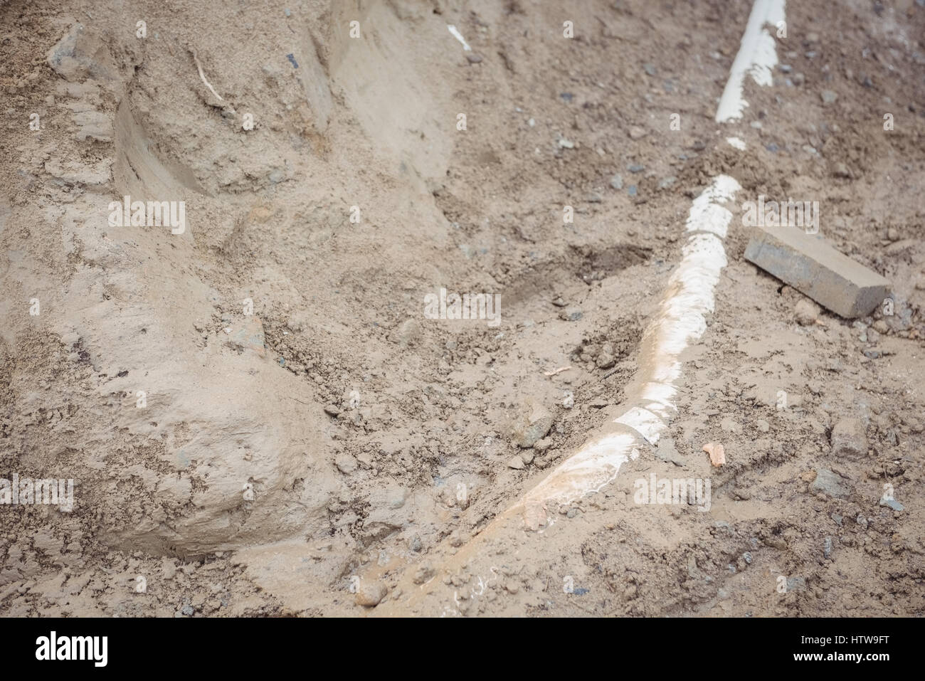 Drainage pipe under mud Stock Photo Alamy