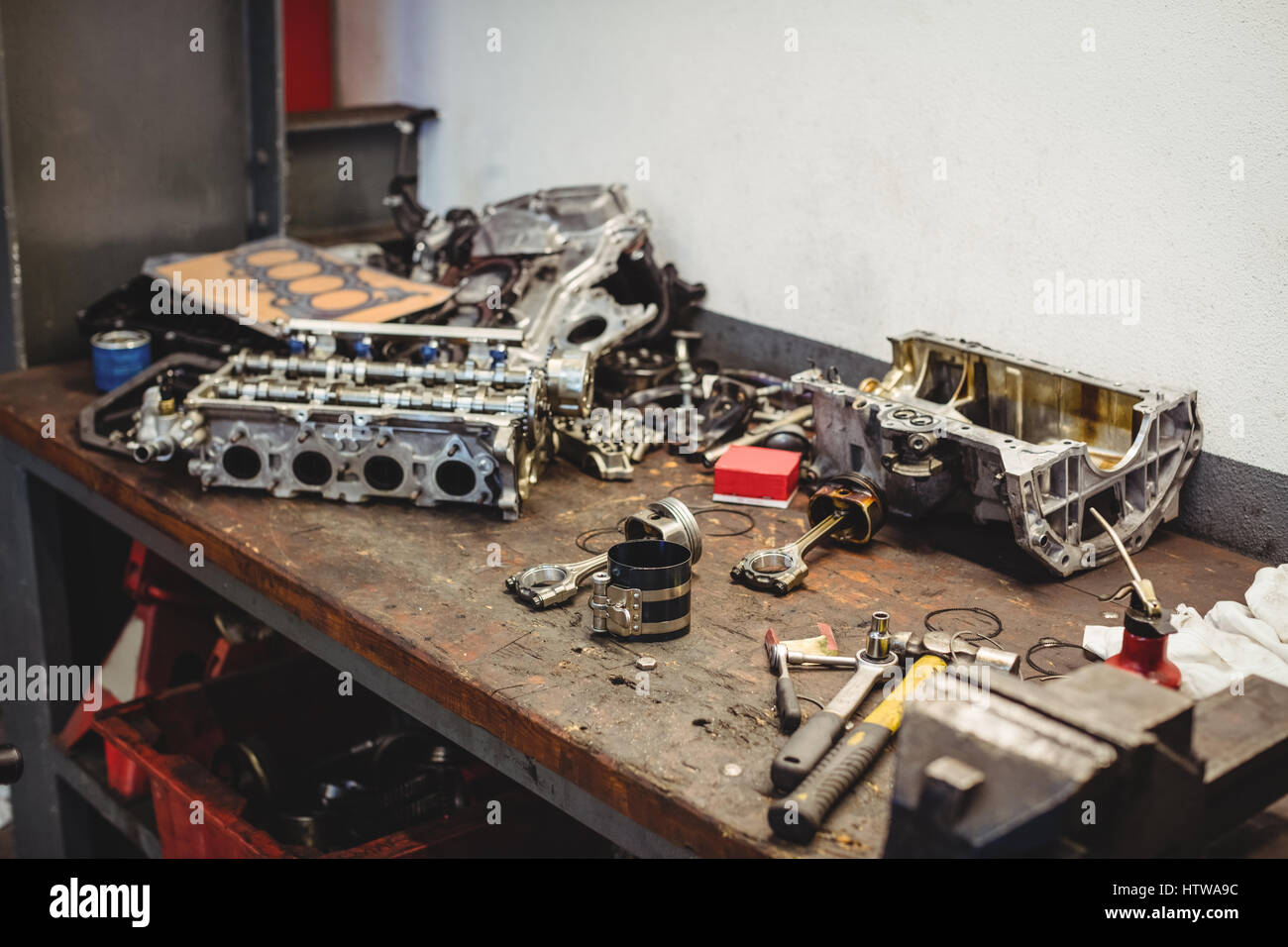 Workbench with car parts and tools Stock Photo