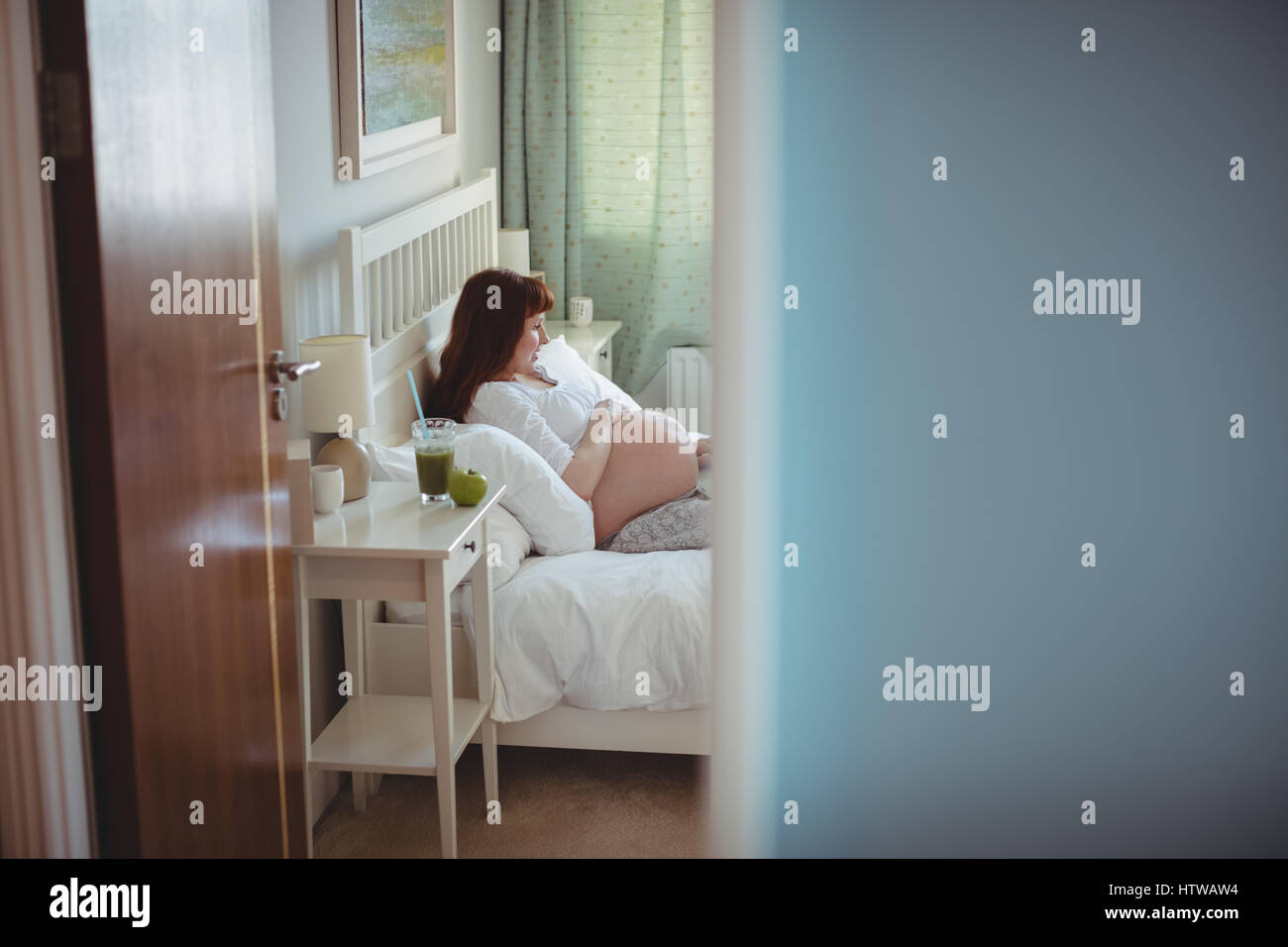 Woman relaxing on bed hi-res stock photography and images - Alamy
