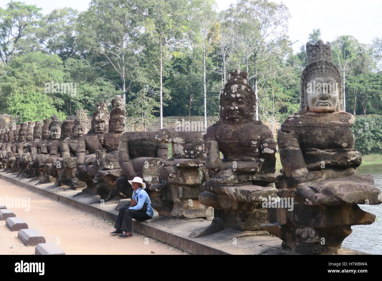 Ancient buddha statues on bridge angkor thom hi-res stock photography ...