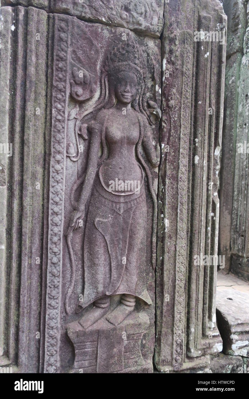 Angkor Thom was the last and most enduring capital city of Khmer empire. It was very rich and huge. Lots of nice bed-reliefs on the walls. Stock Photo
