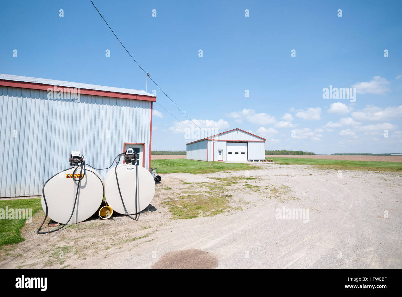 Gasboy fuel tanks and outbuildings on a corn farm in rural southern Ontario Canada. Stock Photo