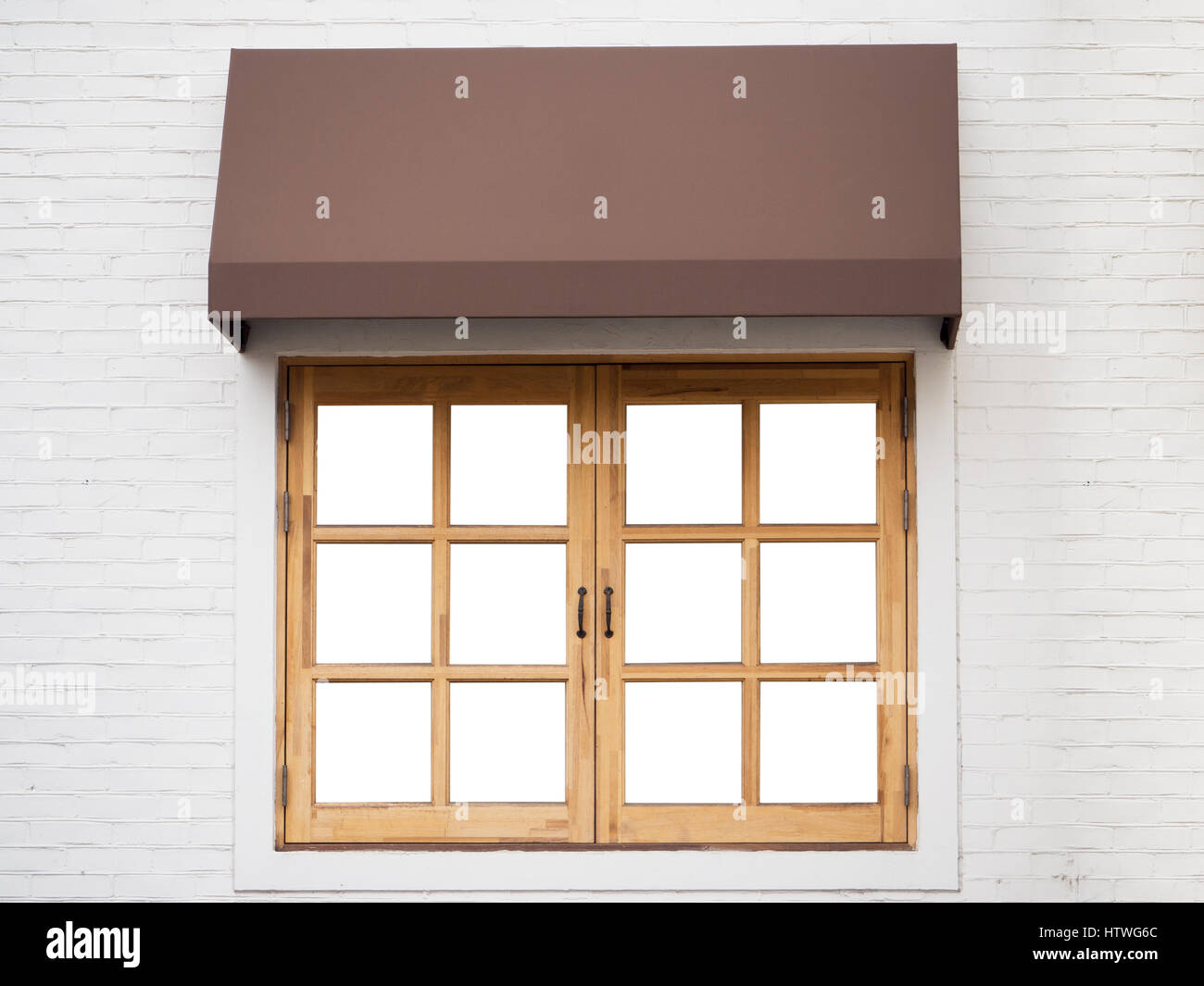 Cafe outside with white wall, wooden window and brown awning Stock Photo