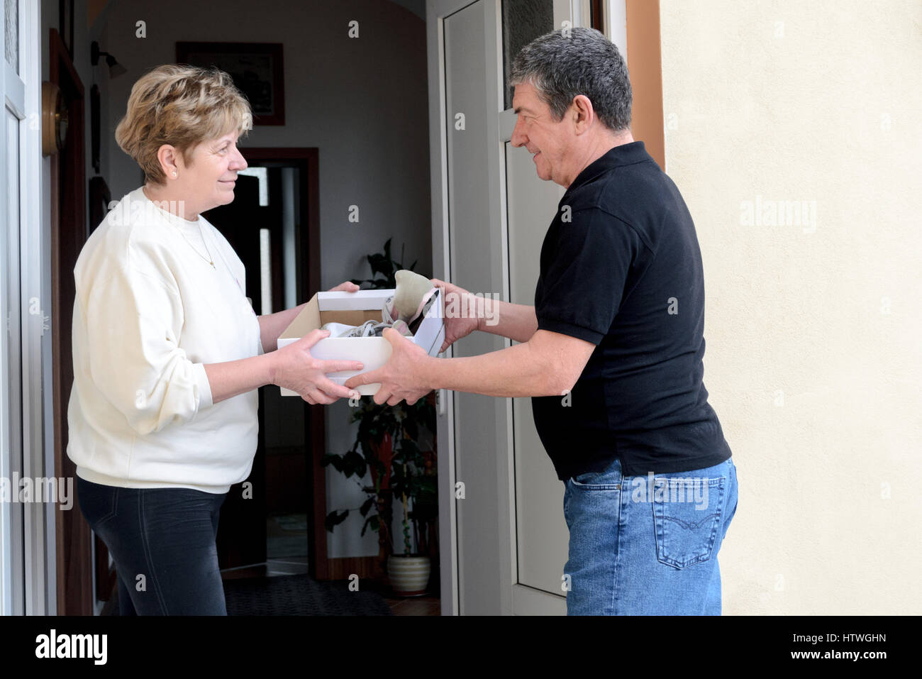 Greeting at the door hi-res stock photography and images - Alamy