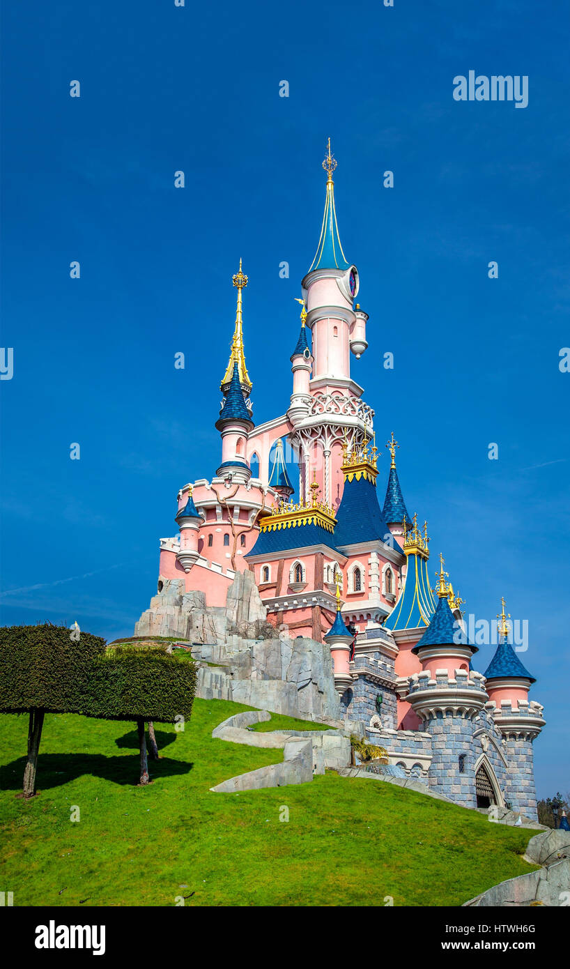 Disney Castle, Disneyland Paris, Paris, France, 25th March 2013 Image of the Disneyland Castle in the sunshine and blue sky in Paris, France Stock Photo