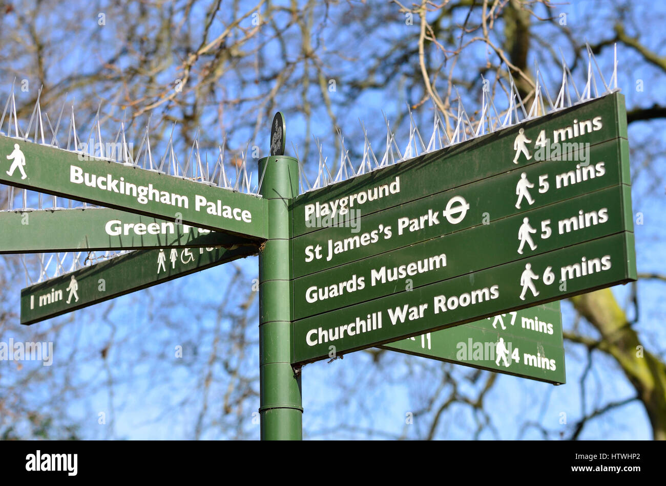 London, UK. Signpost in St James' Park showing dirstions to tourist sights - with anti-pigeon spikes. Stock Photo