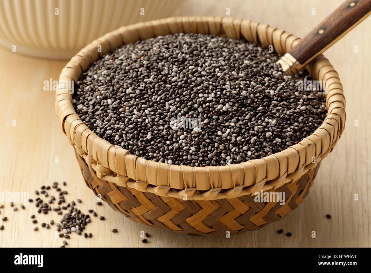 Raw chia seeds in a basket Stock Photo