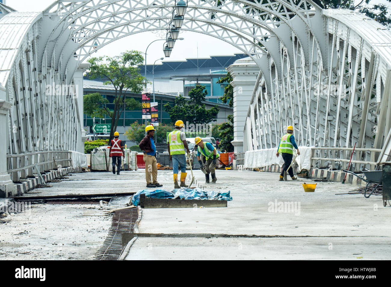 Workmen working on the renovation of Anderson Bridge, Singapore. Stock Photo