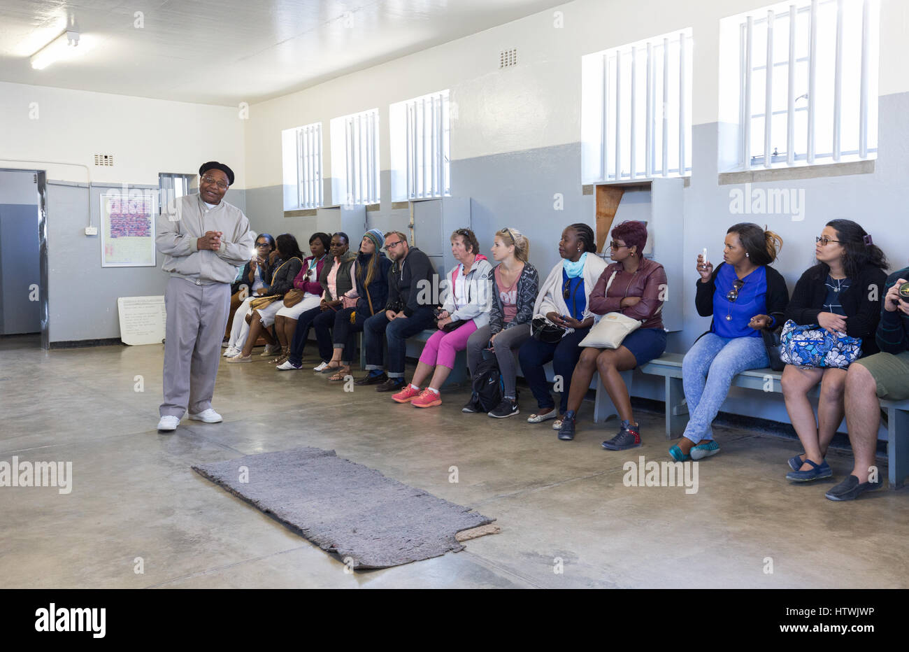 Robben Island Cape Town South Africa - Tourists on the Prison tour with guide, former inmate Ntando Mbatha Stock Photo