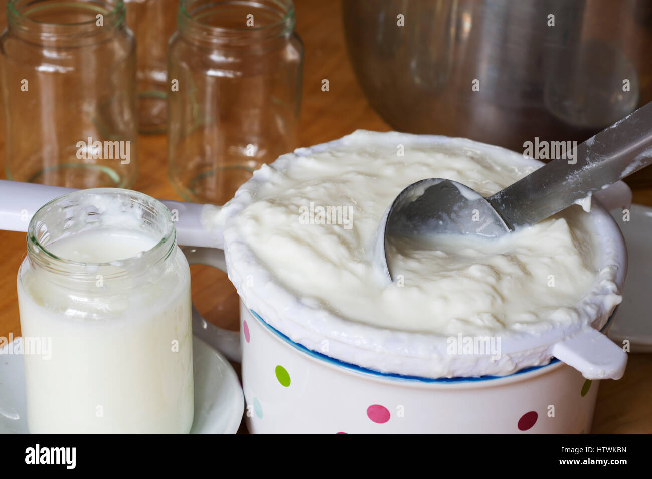 Straining homemade yogurt Stock Photo Alamy