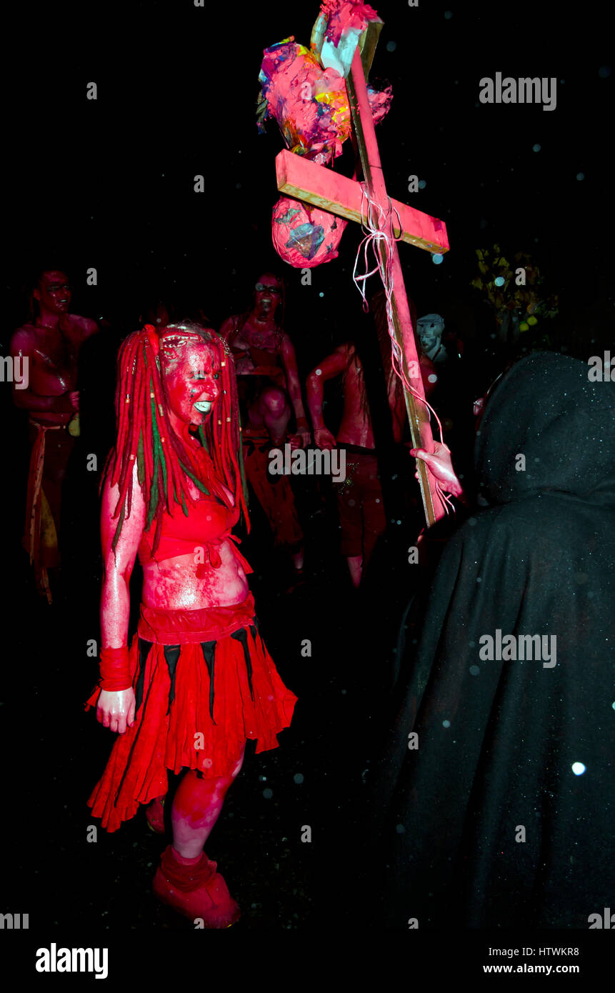 Members of the Beltane Fire Society preparing to  take part in the Samhuinn parade down the Royal Mile in Edinburgh, Scotland in heavy rain. Stock Photo