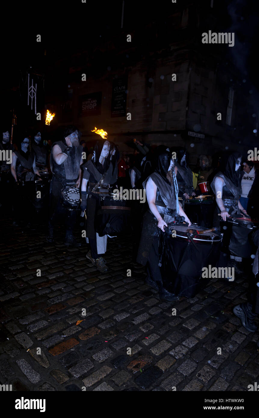 Members of the Beltane Fire Society taking part in the Samhuinn parade down the Royal Mile in Edinburgh, Scotland on Halloween in heavy rain. Stock Photo