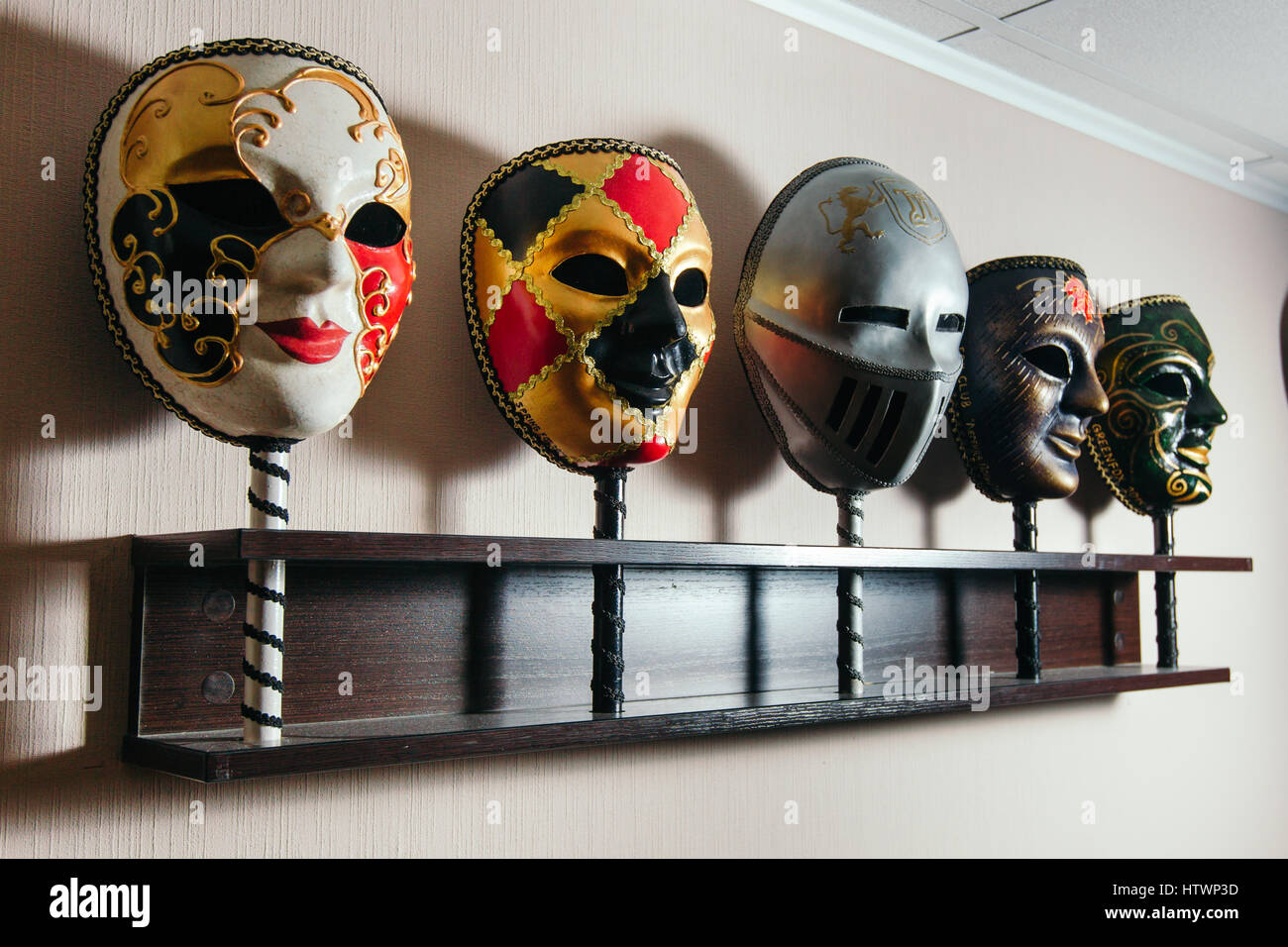 Masks for playing in the mafia stand on the shelf Stock Photo Alamy