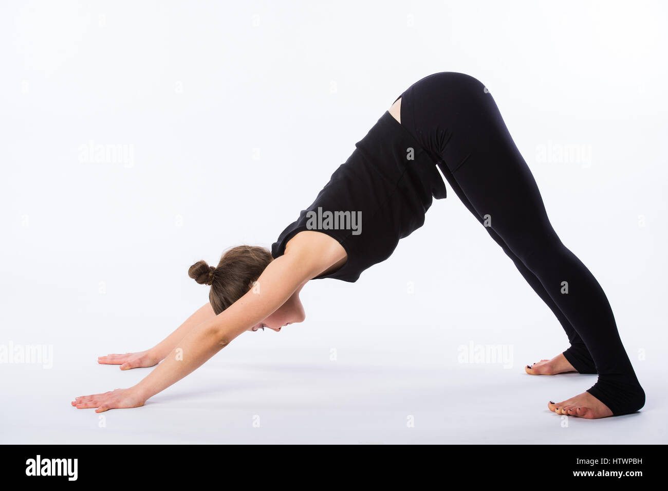 healthy yoga stretching woman does a downward facing dog. This is healthy yoga stretching woman does a downward facing dog. This is