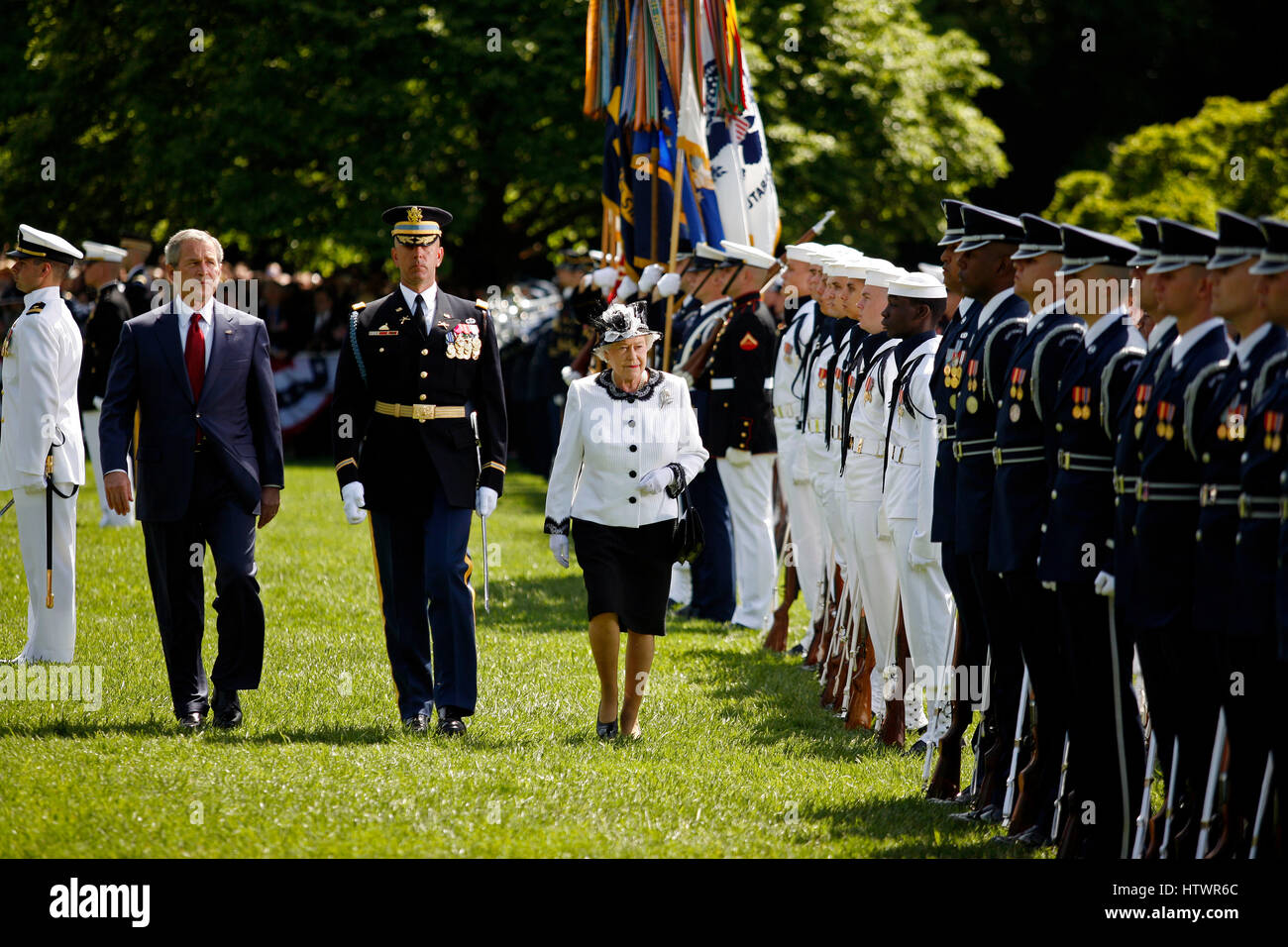 Washington, D.C - May 7, 2007 -- Queen Elizabeth II of the United Kingdom reviews the troops with President George W Bush as part of a South Lawn ceremony during her State Visit to the White House, Monday, in Washington, DC, May 7, 2007.. Stock Photo