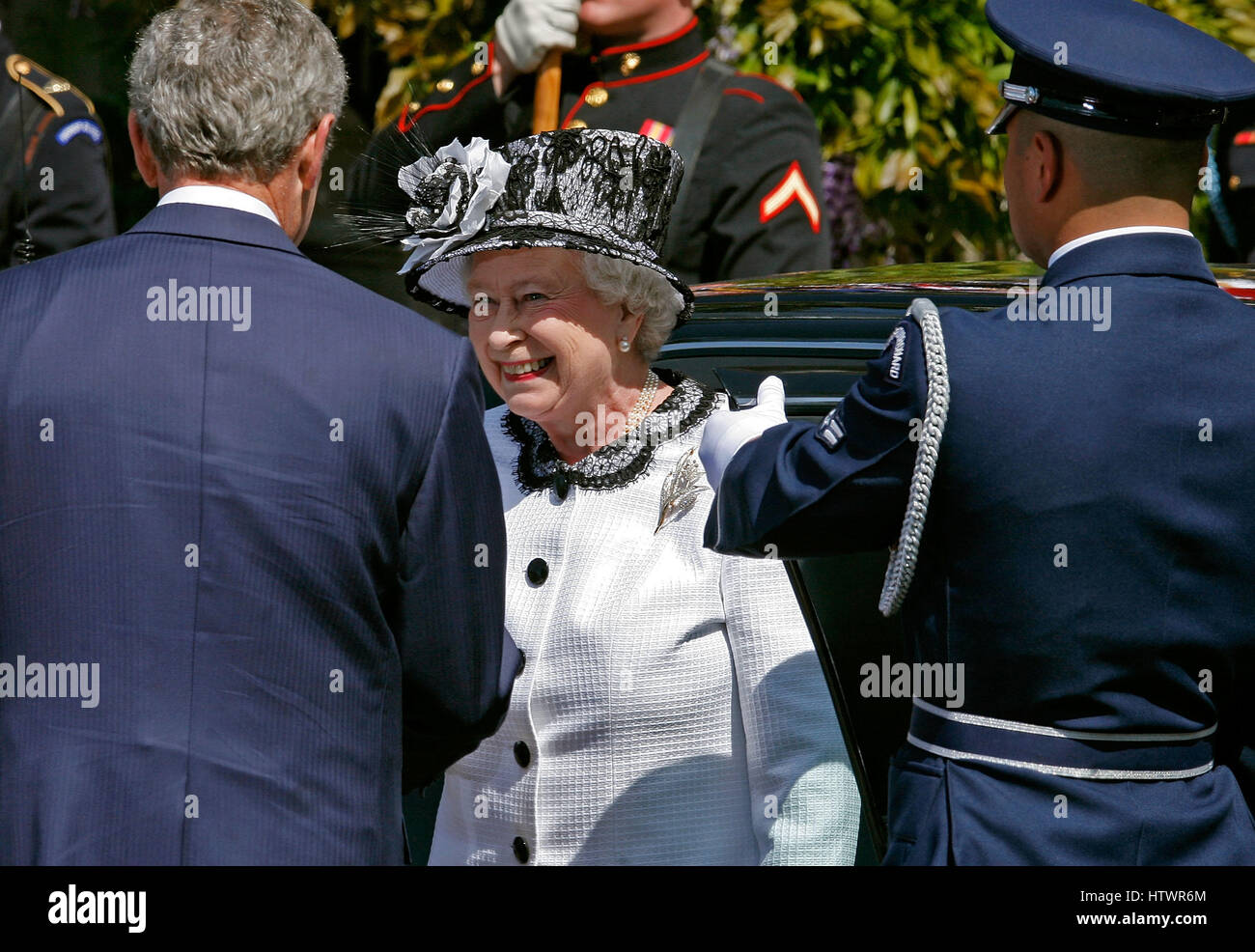 WASHINGTON - MAY 07: (AFP OUT) U.S President George W Bush (G) greets HRH Queen Elizabeth II during a ceremony on the South Lawn of the White House May 7, 2007 in Washington, DC The queen and her husband, Prince Philip, the Duke of Edinburgh, are on a six Stock Photo