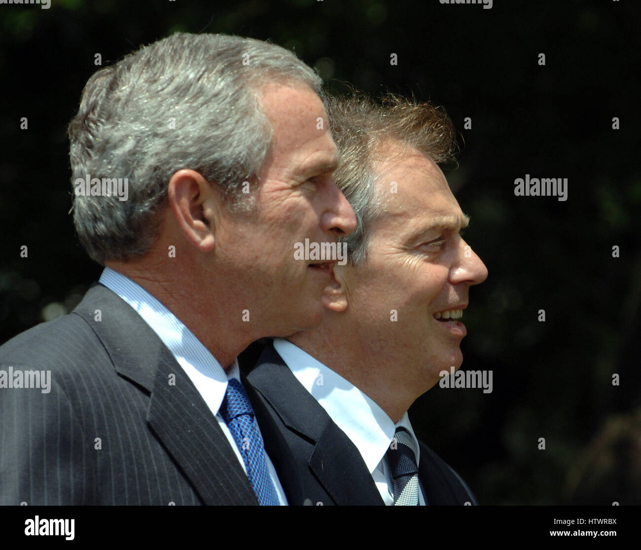 U.S President George W Bush and British Prime Minister Tony Blair walk on the South Lawn of the White House en route to a news conference July 28, 2006 (UPI Photo/Roger L Wollenberg Stock Photo