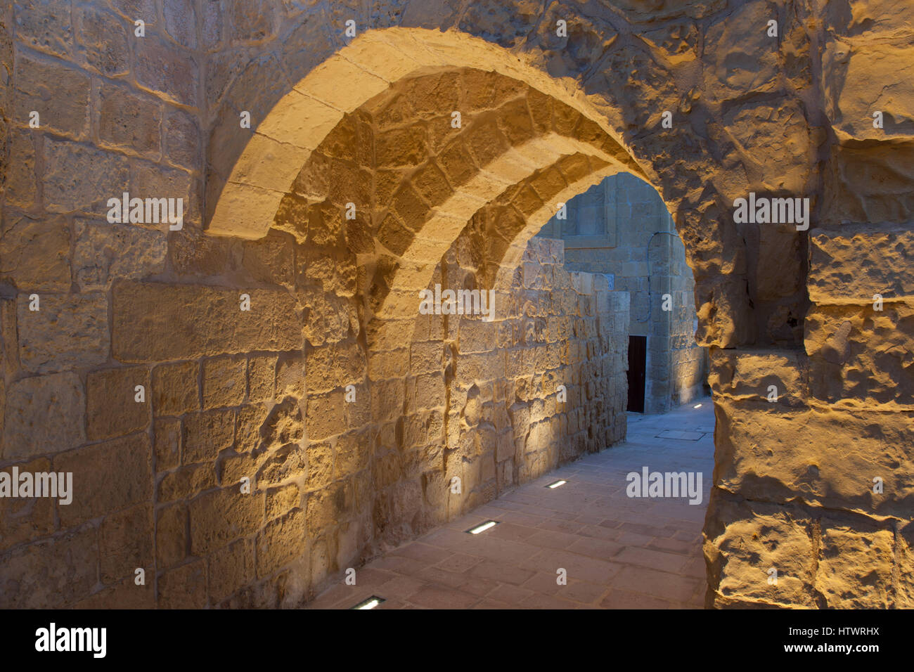 An evocative set of arches survive among the ruins of the Citadel in Gozo. Stock Photo