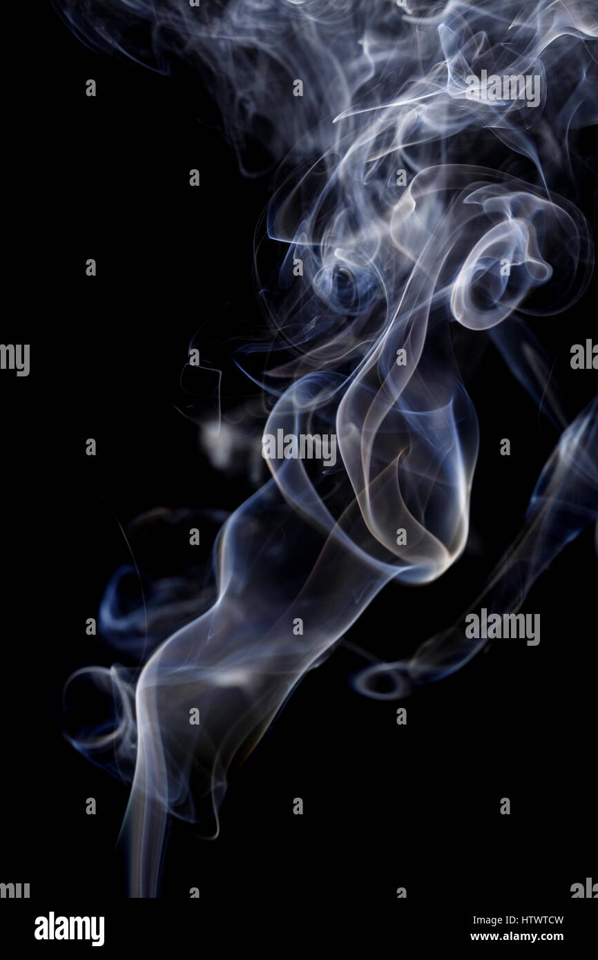 Abstract art. Color white blue smoke from the aromatic sticks on a