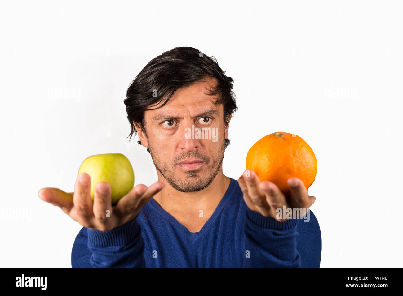 Comparing apples and oranges, a conceptual shot on a traditional saying