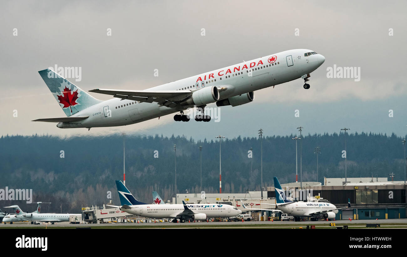 Air Canada Westjet Airlines planes plane airplanes airplane Vancouver International Airport Canadian airline industry company competition Stock Photo