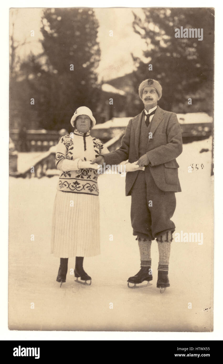Early 1900's postcard of couple in their best clothes skating, possibly Germany or Austria Stock Photo