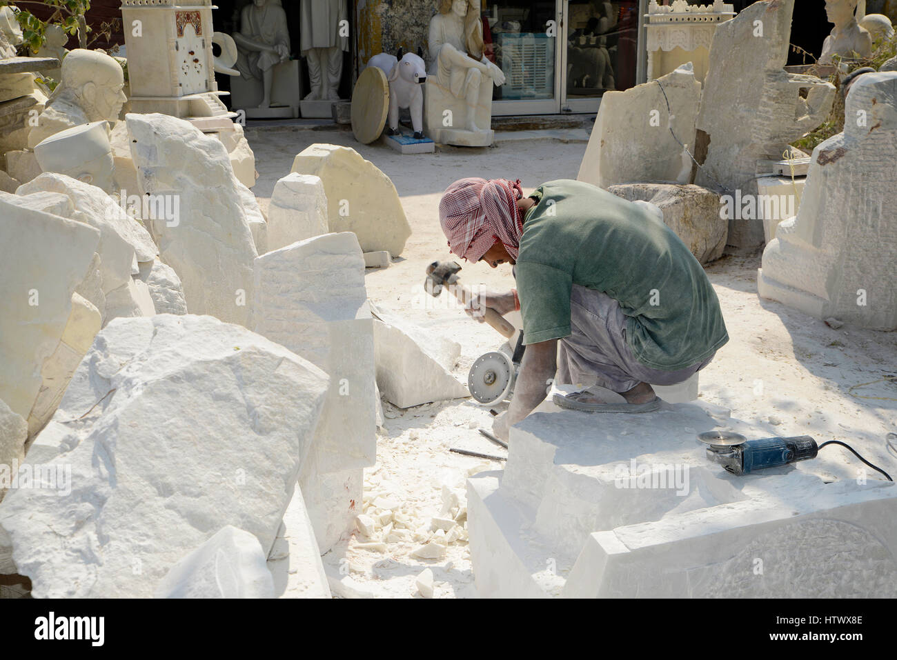 Man making stone sculpture Stock Photo Alamy