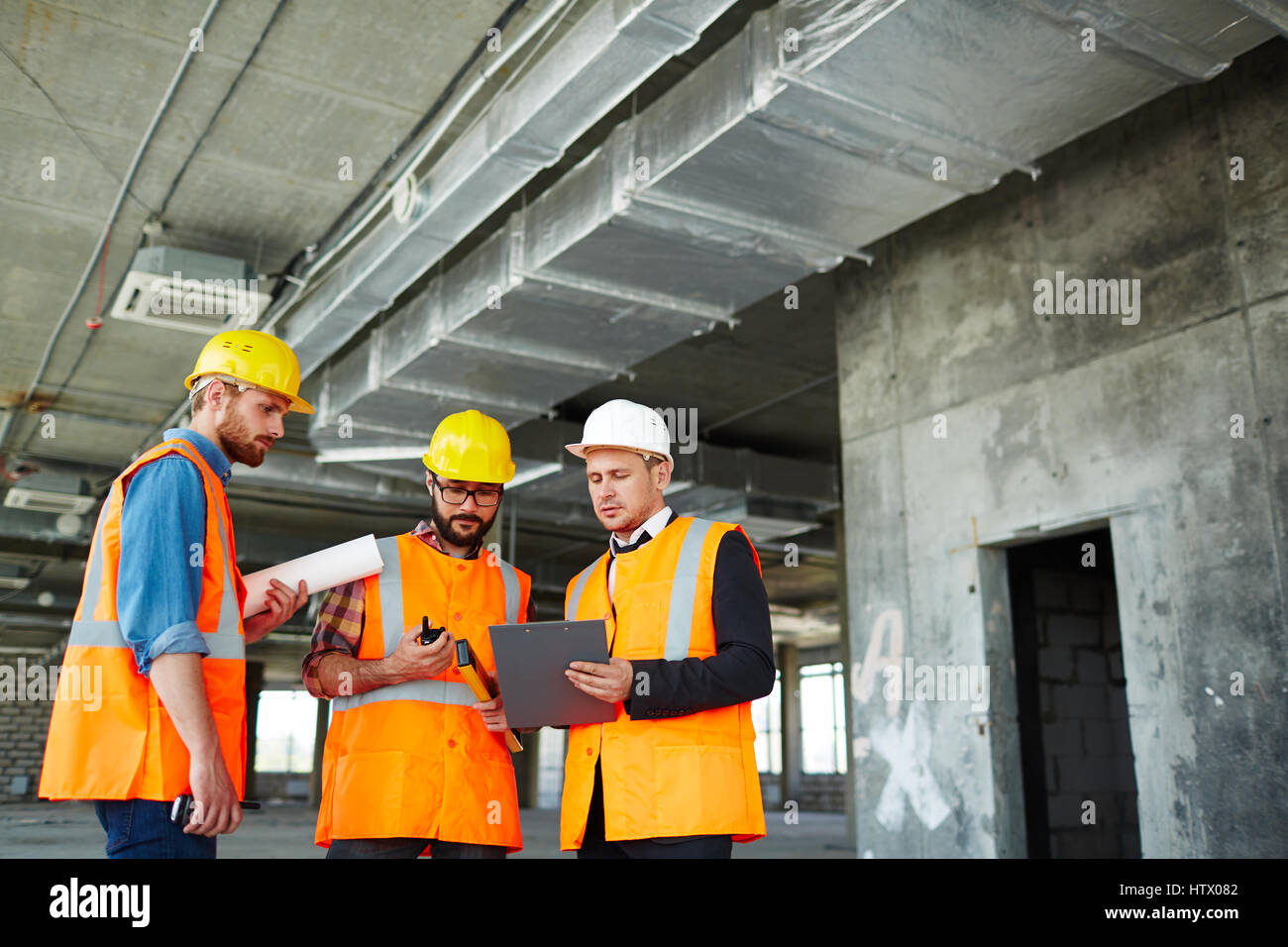 Contemporary engineers planning next work Stock Photo - Alamy