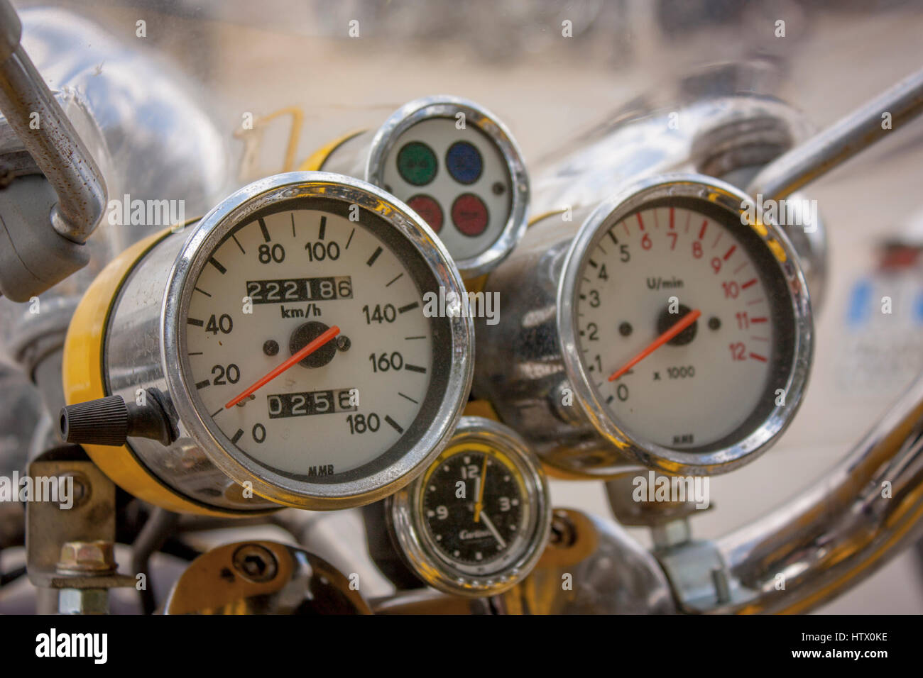 Speedometer of a vintage motorcycle, with worn chrome by time and