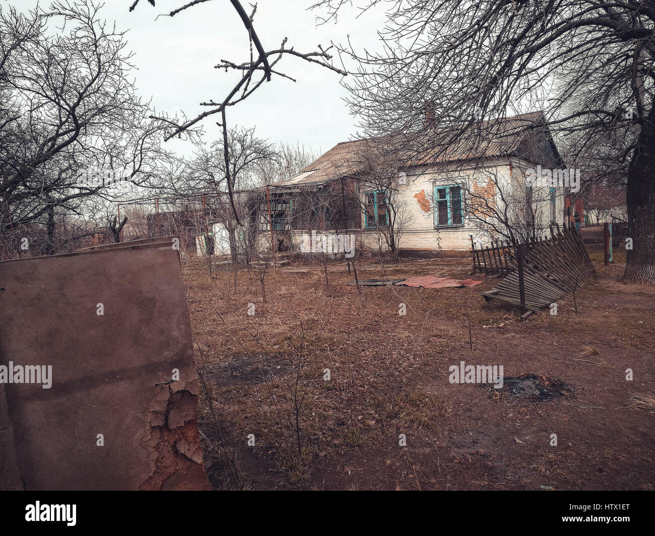 old abandoned house with a tumbled down fence Stock Photo - Alamy