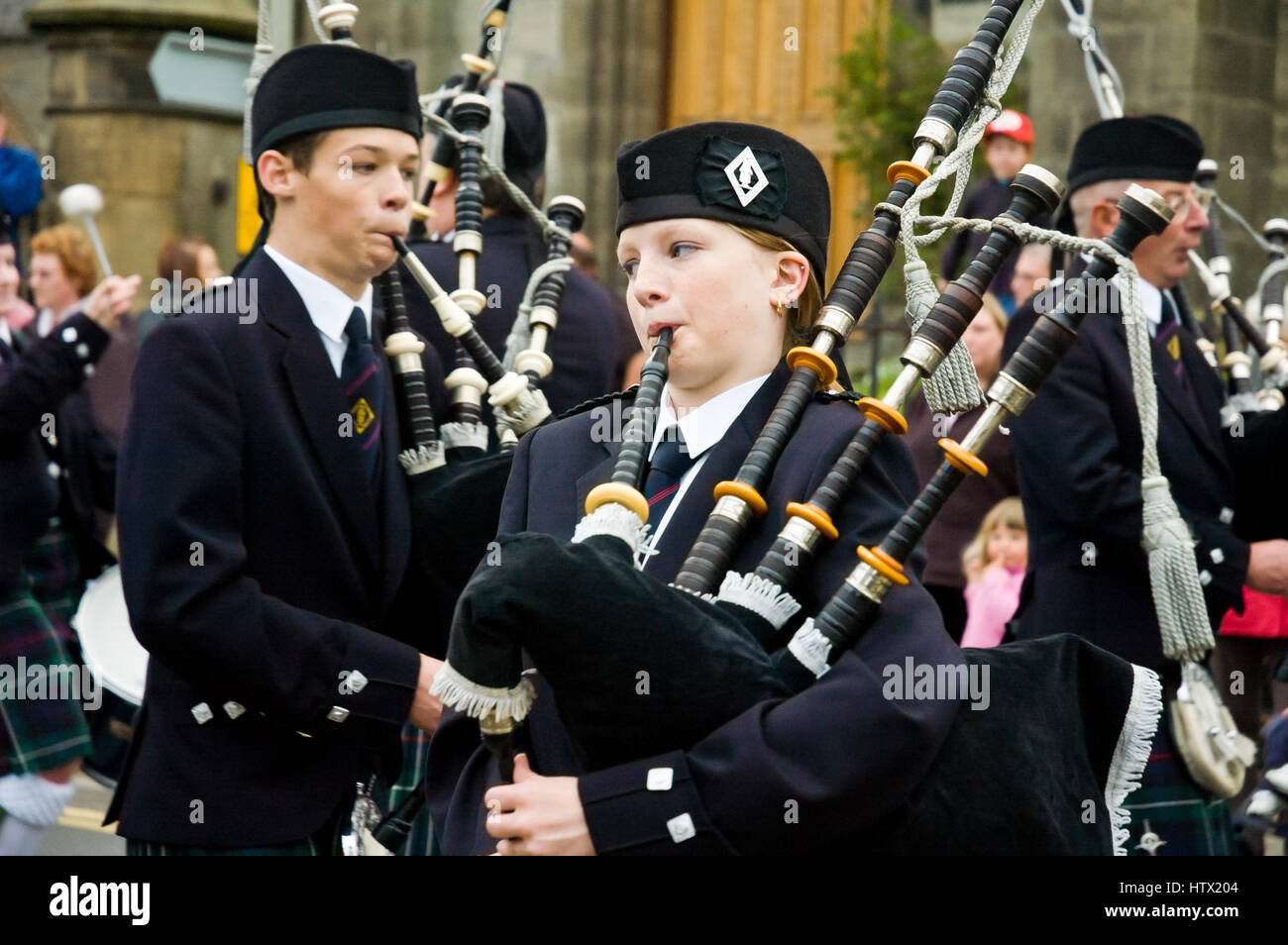 Scottish traditional bagpipes marching band on the street in Thurso Stock Photo