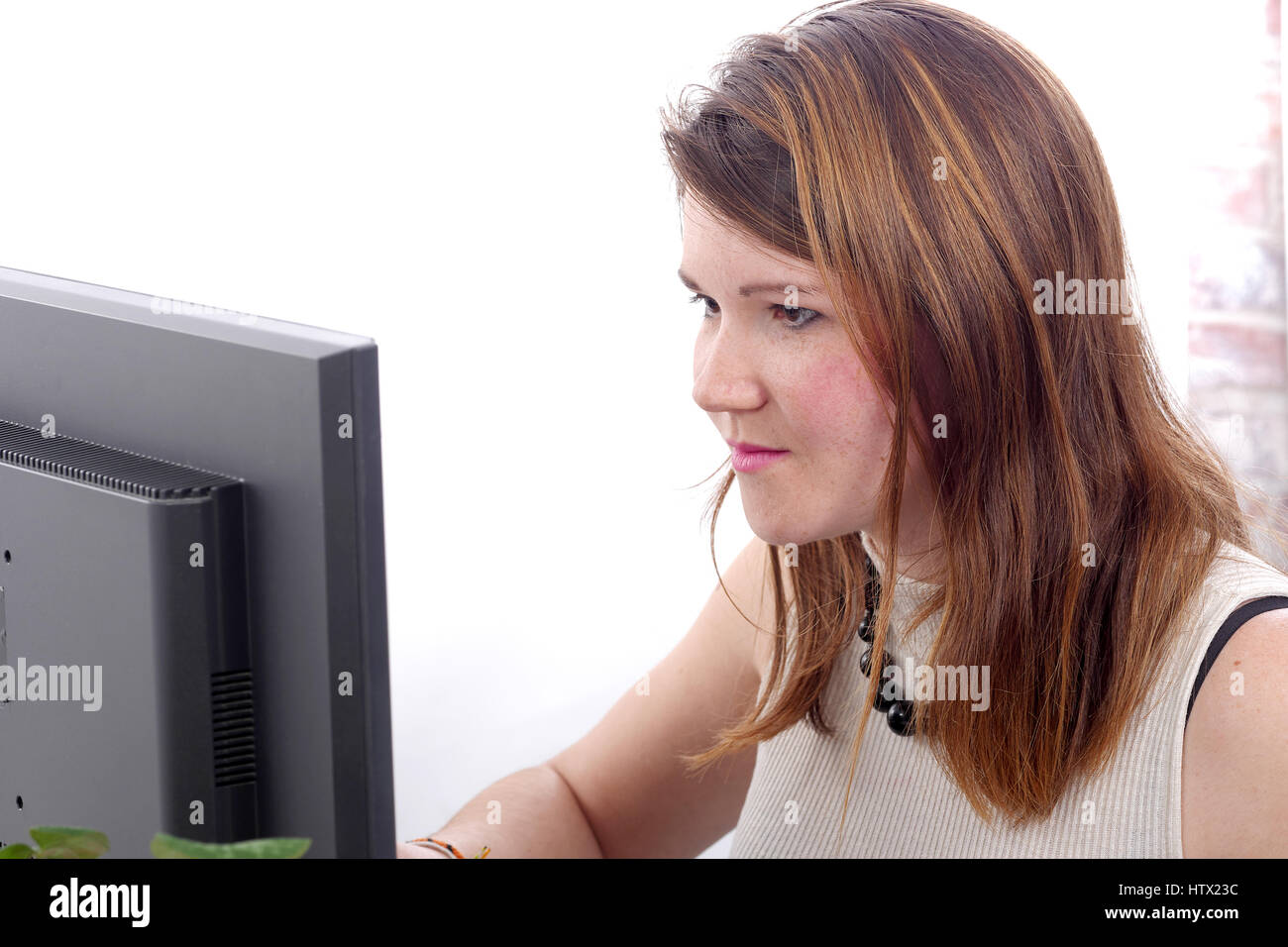 pretty young business woman working at pc in her office Stock Photo - Alamy