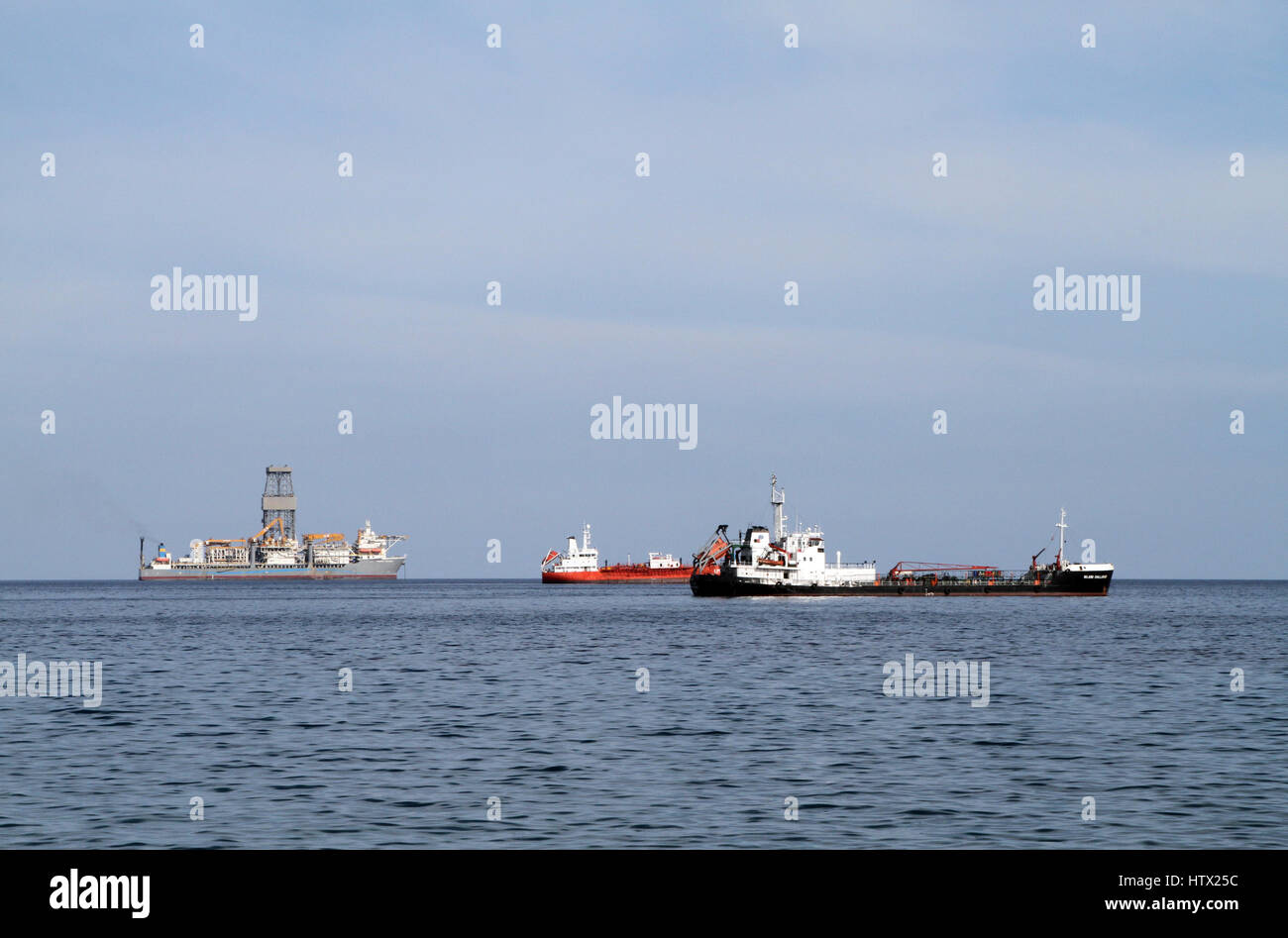The Island Challenger (right), an oil products tanker, lying off the coast from Limassol, Cyprus, with other vessels. Stock Photo