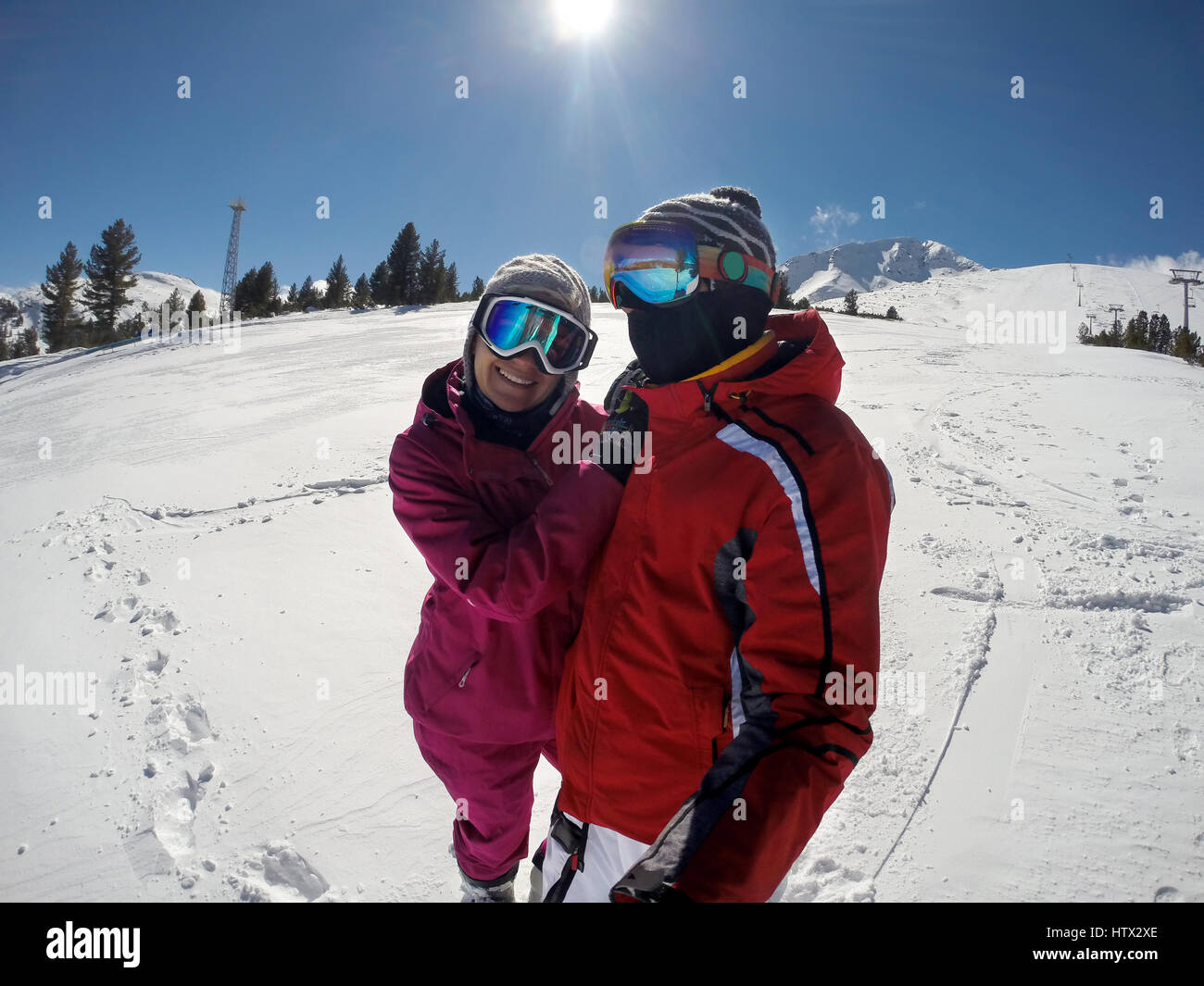 Young couple enjoying in healthy winter sport on mountain Stock Photo
